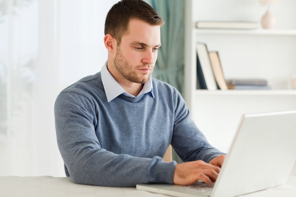 Young man working on his notebook